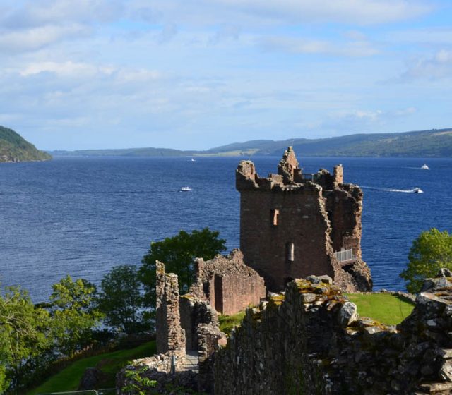 Loch Ness and Urquhart Castle ruins in the Scottish Highlands.